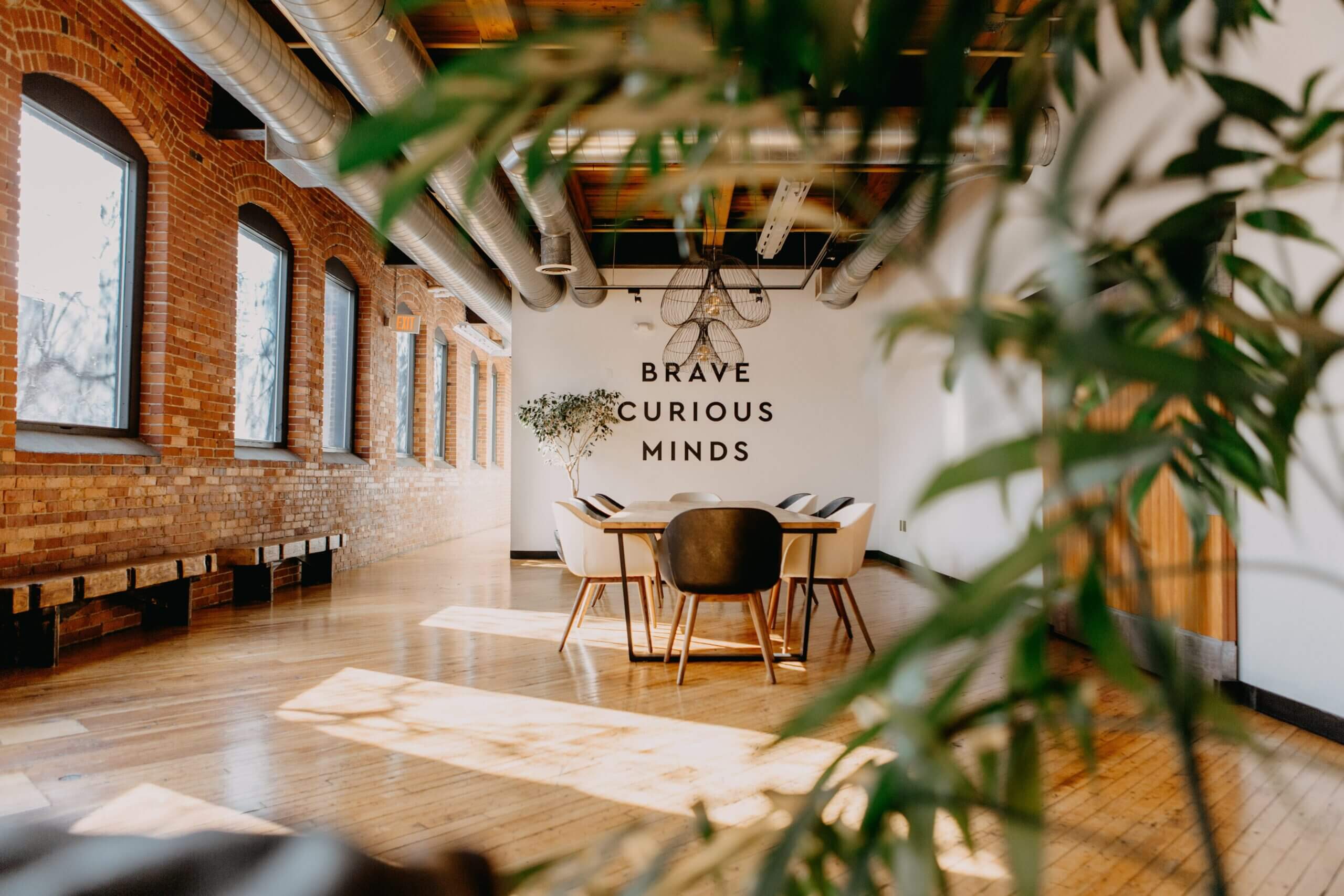 An empty table in an industrial style, sunlit office